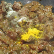 Add tomato paste, salt, pepper and turmeric. Mix the ingredients.