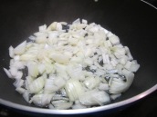 Heat oil in a deep nonstick pan over medium high heat. Add chopped onions.